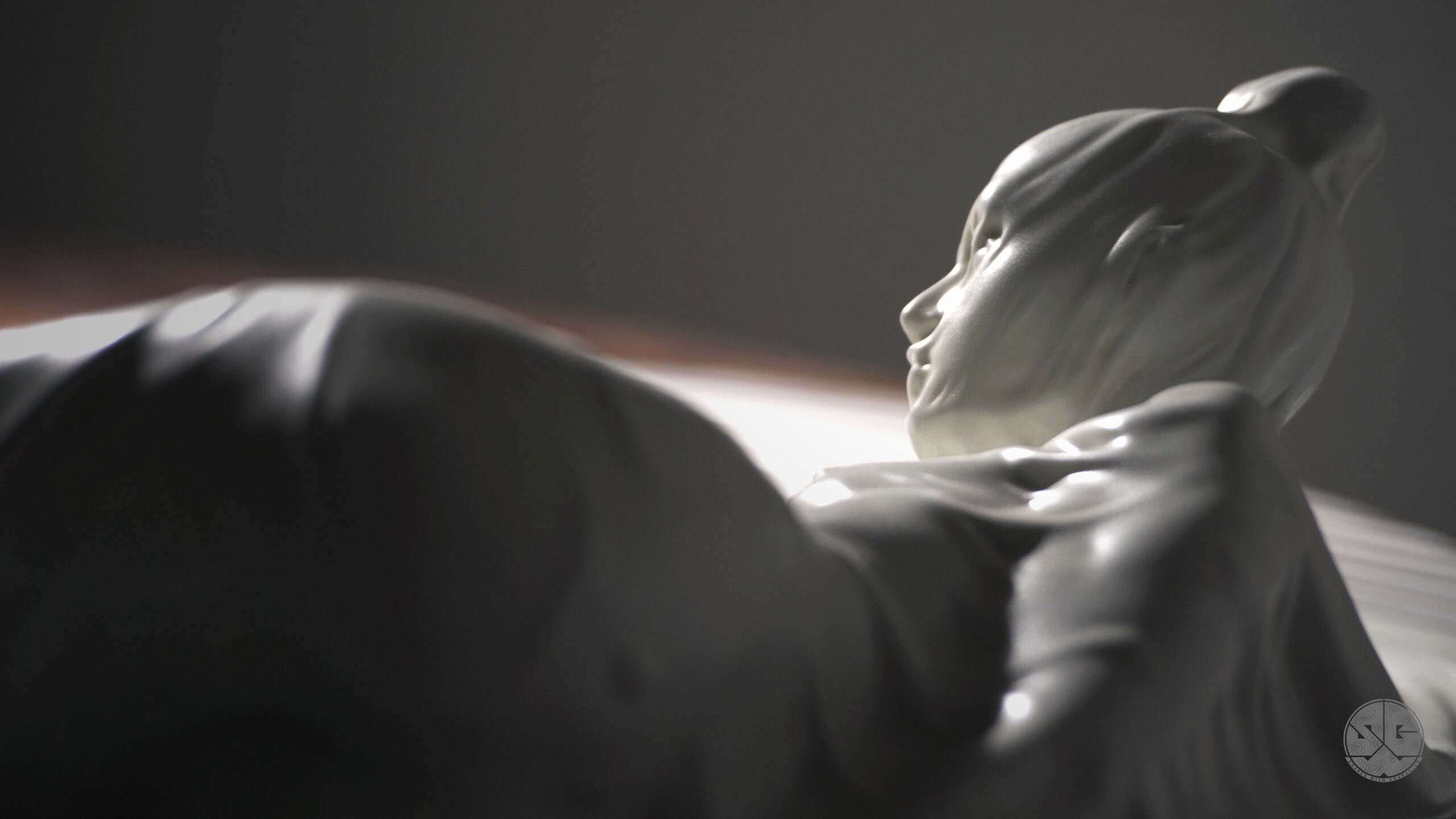 Resting Lady sculpture from behind